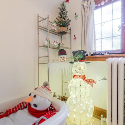 A melting snowman in a bath tub